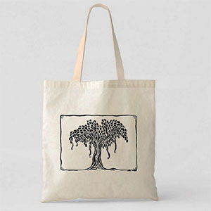 photo of a tote bag with an illustration of a tree on it
